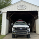 Image for article titled The 2021 Ford F-250 Lariat Tremor With A Ramp Kit Makes A Pretty Great Way To Haul A Changli Across The Country